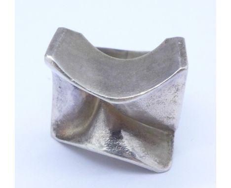 An Arts and Crafts ring, tests as silver, retailed by Köhler, Windhoek, Namibia, boxed, K