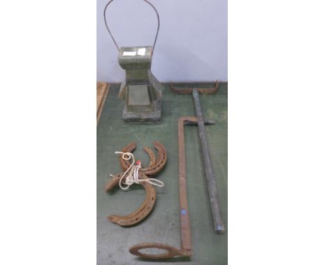 A railway lamp, pump and five horseshoes