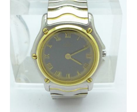 A lady's two tone stainless steel Ebel wristwatch, bezel and screws test as 18ct gold, lacking button