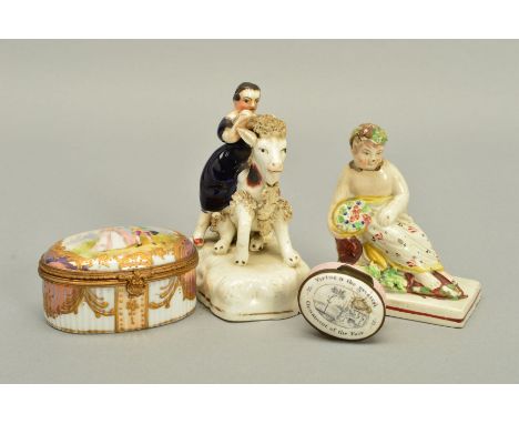 A 19TH CENTURY STAFFORDSHIRE POTTERY FIGURE OF A GIRL SEATED ON THE BACK OF A GOAT, she holds onto his horns, on a shaped bas