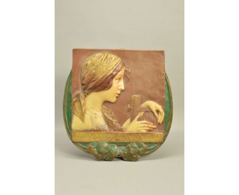 AN EARLY 20TH CENTURY ERNST WAHLISS ART NOUVEAU POTTERY PLAQUE, moulded in relief with a portrait of a lady wearing a head sc