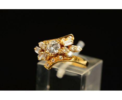 A MODERN DIAMOND DRESS RING, centring on a modern round brilliant cut diamond, estimated weight 0.45ct, colour assessed as F-