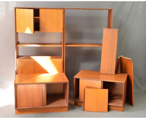 A NEAR PAIR OF G PLAN TEAK BOOKCASES, one section with double doors above single shelf and fall front door, the other with va