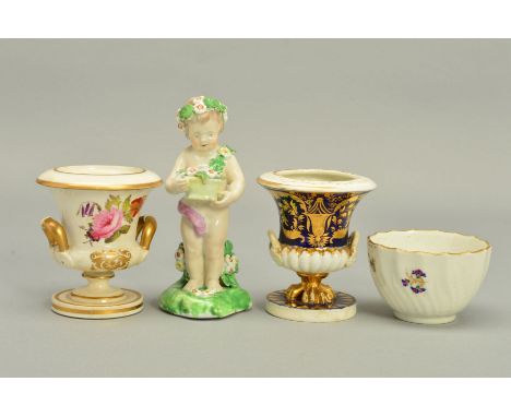 A LATE 18TH CENTURY DERBY PORCELAIN FIGURE OF SPRING, in the form of a putto wearing garlands of flowers and holding a basket