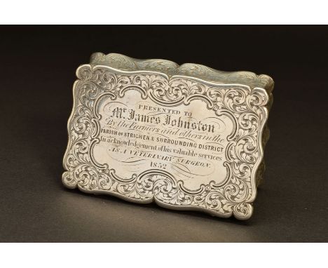 A VICTORIAN SILVER SNUFF BOX, of shaped rectangular form, foliate engraved decoration throughout with presentation inscriptio