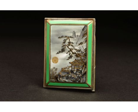 A GEORGE V SILVER AND ENAMEL AIDE MEMOIRE, of rectangular form, the hinged cover enamelled with a Japanese landscape in muted