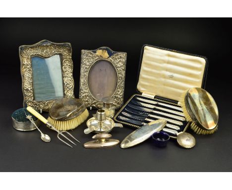 A PARCEL OF SILVER, the majority Edwardian and George V, includes a pair of oval silver backed brushes, a pin cushion topped 