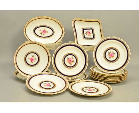 A CAULDON CHINA PART DESSERT SERVICE, hand painted roses to the centres surrounded by bands of gilt and cobalt blue, twelve p