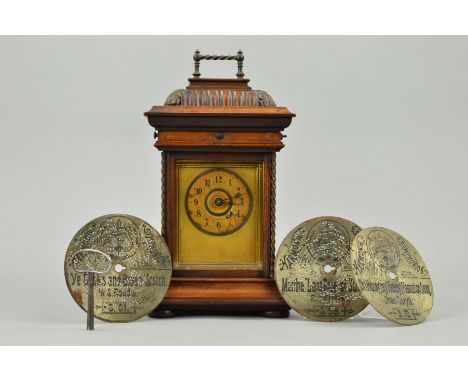 A LATE 19TH CENTURY JUNGHANS SYMPHONION DISC MANTEL CLOCK, the moulded caddy top with fixed metal handle opening to reveal th