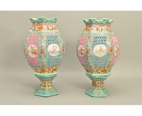 A PAIR OF 20TH CENTURY CHINESE PORCELAIN FAMILLE ROSE TABLE LANTERNS, of hexagonal form, reticulated sections divided by pane