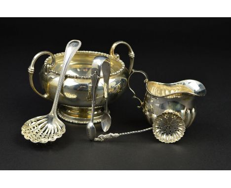 A GEORGE V SILVER TWIN HANDLED SUGAR BOWL, of circular form, cast bobbin rims, 'C' scroll handles, makers Walker &amp; Hall, 