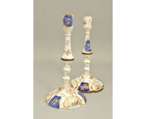 A PAIR OF GEORGIAN BILSTON ENAMEL CANDLESTICKS, both lacking drip pans, knopped stems and domed wavy circular bases, painted 
