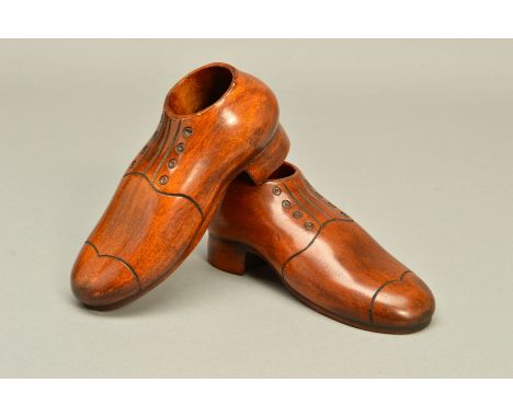A PAIR OF 20TH CENTURY TREEN SHOES, with circular openings, length 16cm (2) (condition: some light scuffs to underside and ed
