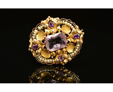 A GOLD AMETHYST AND SEED PEARL BROOCH, the central rectangular amethyst, surrounded by shell and foliate designed panels, wit