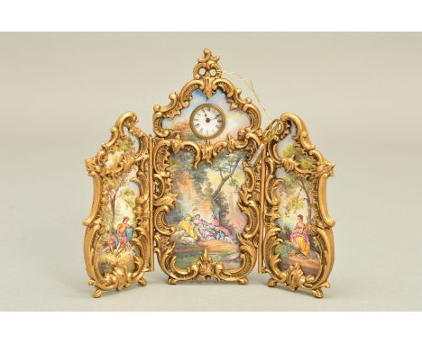 AN EARLY 20TH CENTURY AUSTRIAN VIENNESE GILT METAL AND ENAMEL MINIATURE TRIPTYCH CLOCK, the enamel panels painted with a fete
