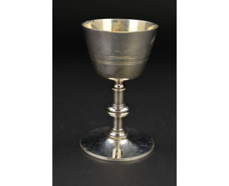 A LATE VICTORIAN SILVER PLATED COMMUNION CHALICE, concentric band decoration, knopped stem, circular foot engraved with patee