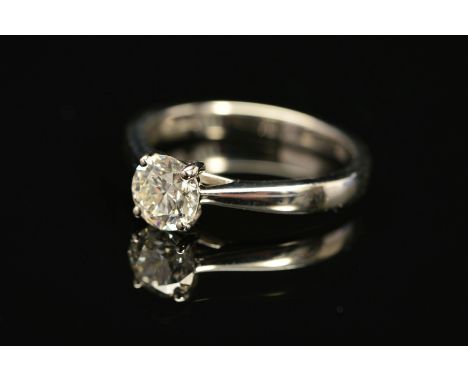 A MODERN PLATINUM DIAMOND SINGLE STONE RING, a modern round brilliant cut diamond, together with a diamond grading report fro