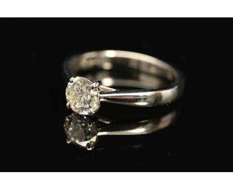 A MODERN PLATINUM DIAMOND SINGLE STONE RING, a modern round brilliant cut diamond, together with a diamond grading report fro