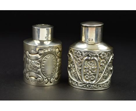 TWO LATE VICTORIAN / EDWARDIAN SILVER TEA CADDIES, the Victorian example with plain circular pull off cover over an oval body