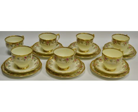 A Salisbury bone china part tea service printed with pink rosebuds and gilded on a buttermilk ground
