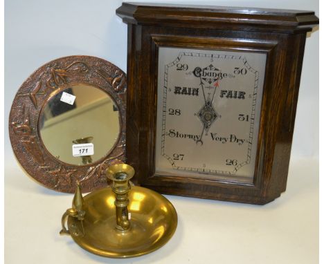 An Art Nouveau embossed to corner looking glass; a George III ejector candlestick with snuffer; an Arts and Crafts rectangula