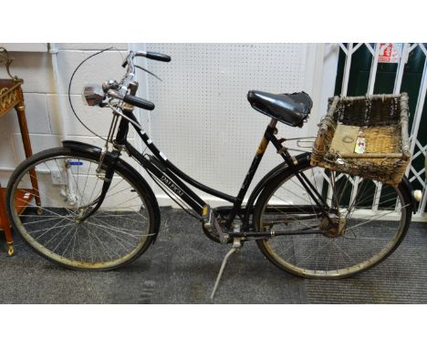A Lady's vintage Raleigh bike, basket ensuite