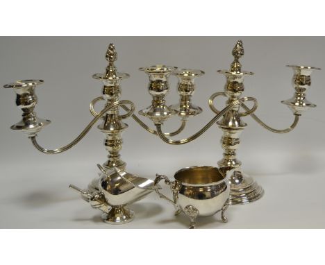 A pair of EPNS three light two branch table candelabra;  sugar scuttle;  cream jug