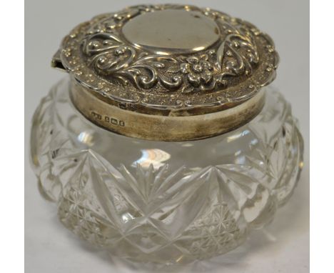 An Edwardian cut glass dressing table bowl, hinged silver lid, Birmingham 1906