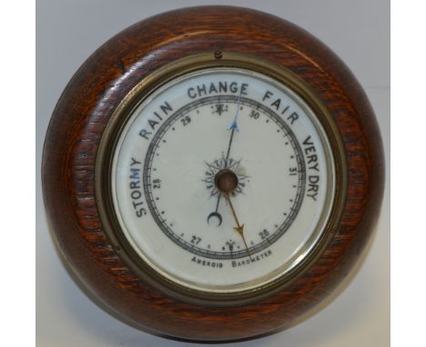A late Victorian oak aneroid barometer, c.1895