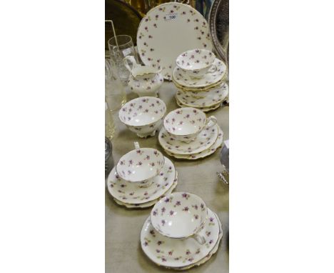 A Cauldron tea service of 6 side plates, 5 cups and saucers, milk jug and sugar bowl; 2 bread and butter plates, decorated wi