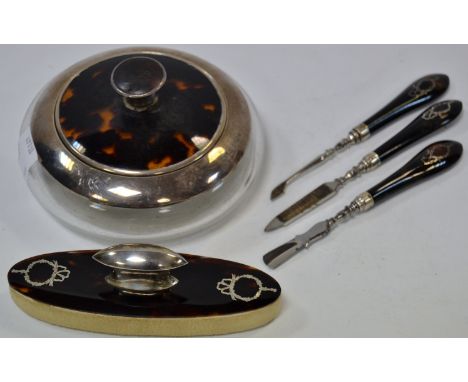 A cut glass dressing table bowl, silver and Tortoiseshell mounts, a conforming nail buffer and manicure aids  