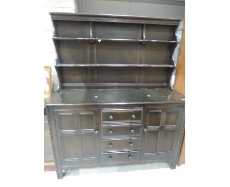 A mid 20th Century dark stained Ercol dresser