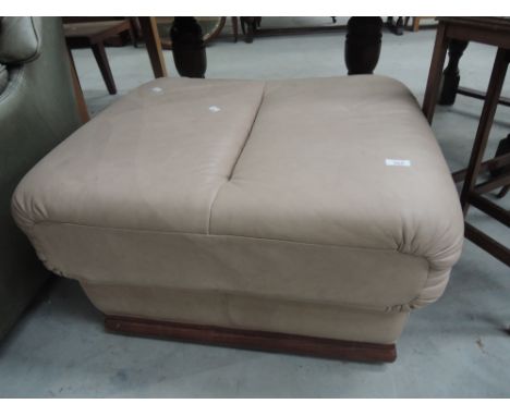 A modern blush leather effect pouffe