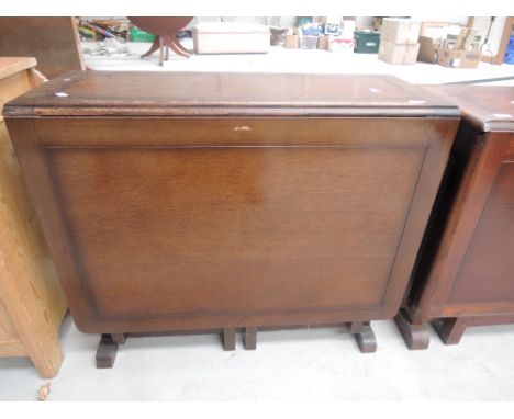 A mid 20th century oak gate legged table