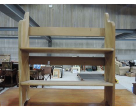 A rustic pine wall shelf