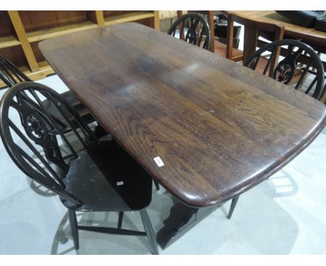 A Ercol dark stained refectory style table and 4 wheelback kitchen chairs