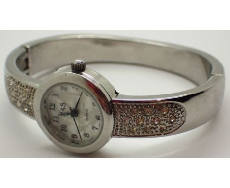 Ladies white metal stone set bangle wristwatch with mother of pearl effect dial with new battery fitted 