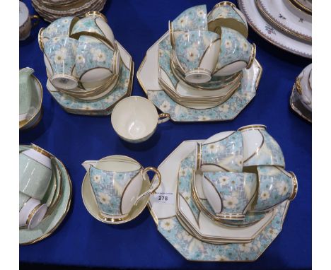 A Paragon Chippendale pattern tea service, comprising thirteen cups, twelve saucers and plates, two cake plates, milk jug and