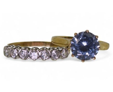 A 9ct eternity ring, set with clear gems, size N, and a 9ct ring, set with a blue gem, size K, weight together 4gms Condition