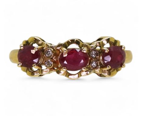 An 18ct gold ruby and diamond dress ring, size O, weight 3.8gms Condition Report:Available upon request