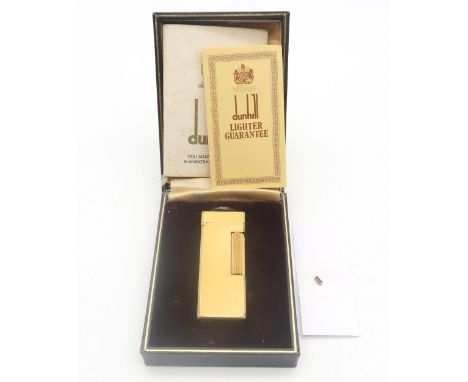 A Dunhill yellow enamel Rollagas cigarette lighter, boxed, with accompanying paperwork and flint Condition Report:Available u