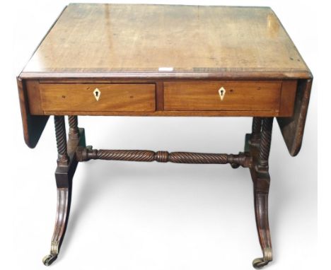 A 19th century mahogany drop end sofa table with two drawers on spiral supports with down swept feet joined by spiral stretch