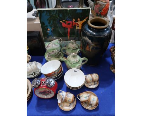 A Chinese animated alarm clock, with student waving red book, three Chinese Cultural Revolution bowls, boxed vinyl recording 