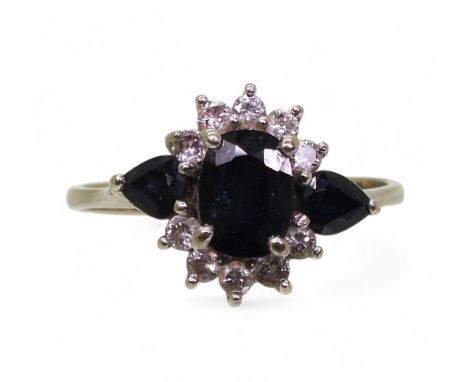 An 18ct white gold sapphire and diamond cluster ring, size N1/2, weight 3.3gms Condition Report:Available upon request