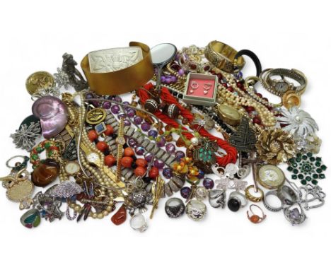 A collection of costume jewellery, including two poodle brooches, a luckenbooth brooch, a pink gem Celtic knot pendant, owl j