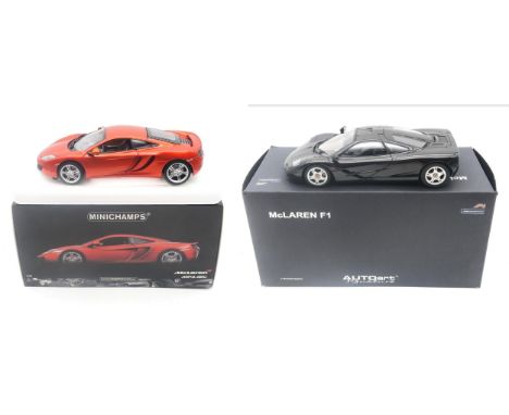 A boxed Autoart Signature 1:18-scale McLaren F1 road car; and a Minichamps McLaren Mp4.12C, limited to an edition of 2,500 (2