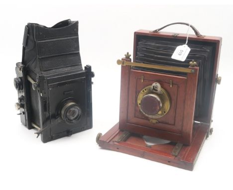 A mahogany and brass bellows camera, fitted with a Bausch &amp; Lomb "Unicum" lens,&nbsp; retailed by J. Lizars of Glasgow, B