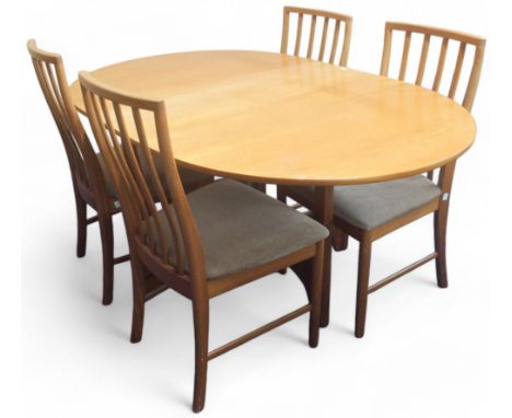 A mid 20th century teak McIntosh dining table and four chairs, dining table with drop ends of shaped gate legged cruciform ba