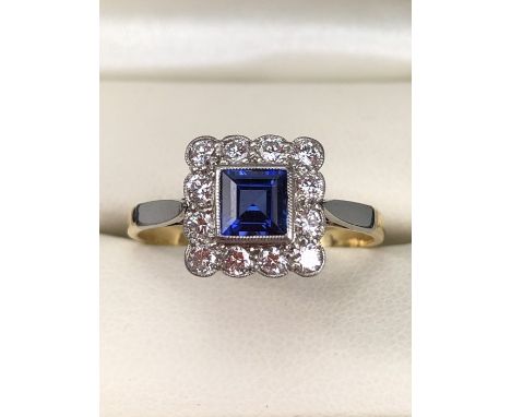 18ct Gold and Platinum ring with Blue central stone and diamonds 