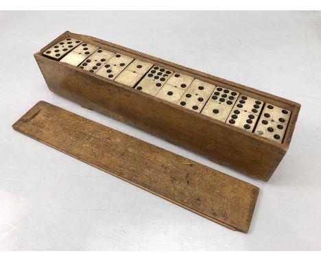 Set of vintage dominoes in wooden case